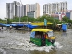 Commuters make way through a waterlogged road as the swollen Gomti inundates Shaheed Path area, in Lucknow on Thursday. (ANI Photo)