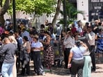 People evacuated from a building gather at a square after a severe earthquake hit the country, in Panama City.