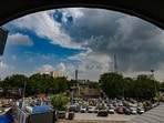 File photo: People walk under a monsoon sky outside the New Delhi Railway Station in New (RAJ K RAJ /HT PHOTO)