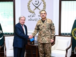 This handout photograph taken and released by Pakistan's Inter-Services Public Relations (ISPR) on October 7, 2026 shows Pakistan's Army Chief and Field Marshal Syed Asim Munir (R) shaking hands with United Nations Secretary General Antonio Guterres before their meeting in Rawalpindi. (Photo by Pakistan's Inter-Services Public Relations (ISPR) / AFP) / RESTRICTED TO EDITORIAL USE - MANDATORY CREDIT "AFP PHOTO /Pakistan's Inter-Services Public Relations (ISPR) " - HANDOUT - NO MARKETING NO ADVERTISING CAMPAIGNS - DISTRIBUTED AS A SERVICE TO CLIENTS