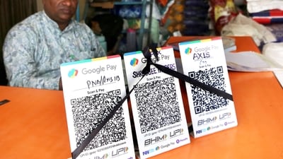 Bhopal, Oct 08 (ANI): A shopkeeper covers QR code with black ribbons in the wake of the implementation of Merchant Discount Rate (MDR) for UPI transactions, as wholesale pulses and rice merchants observe NO UPI Day, in Bhopal on Thursday. (ANI Photo) (Sanjeev Gupta) Bhopal, Oct 08 (ANI): A shopkeeper covers QR code with black ribbons in the wake of the implementation of Merchant Discount Rate (MDR) for UPI transactions, as wholesale pulses and rice merchants observe NO UPI Day, in Bhopal on Thursday. (ANI Photo) (Sanjeev Gupta)