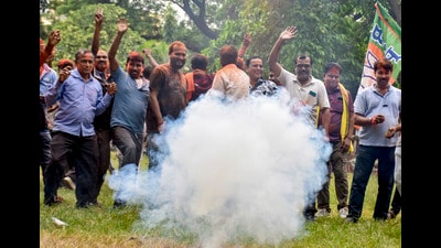 BJP supporters burst firecrackers to celebrate the party’s win in the Rejinagar bypolls in Murshidabad on Friday. (PTI) BJP supporters burst firecrackers to celebrate the party’s win in the Rejinagar bypolls in Murshidabad on Friday. (PTI)