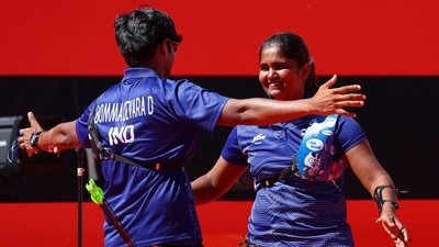 India's Kumkum Mohod celebrates with Dhiraj Bommadevara after reaching the final (REUTERS/Anushree Fadnavis)