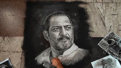 Rangoli artist Shreehari Pavale works on a rangoli portrait paying tribute to veteran actor Nana Patekar, in Vashi, Navi Mumbai, Thursday, Oct. 8, 2026. (PTI) Rangoli artist Shreehari Pavale works on a rangoli portrait paying tribute to veteran actor Nana Patekar, in Vashi, Navi Mumbai, Thursday, Oct. 8, 2026. (PTI)
