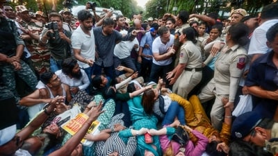 Lok Sabha LoP Rahul Gandhi stops Delhi Police from detaining Congress MP Priyanka Gandhi Vadra and others during the INDIA bloc MPs' protest against Chief Election Commissioner Gyanesh Kumar near Jantar Mantar, in New Delhi on Wednesday. (AICC) Lok Sabha LoP Rahul Gandhi stops Delhi Police from detaining Congress MP Priyanka Gandhi Vadra and others during the INDIA bloc MPs' protest against Chief Election Commissioner Gyanesh Kumar near Jantar Mantar, in New Delhi on Wednesday. (AICC)