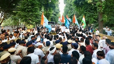Congress supporters gather around the bus as Congress president Mallikarjun Kharge, Lok Sabha LoP Rahul Gandhi, along with INDIA bloc MPs, move towards Rajghat after a meeting at Moets restaurant, in New Delhi on Thursday. (AICC) Congress supporters gather around the bus as Congress president Mallikarjun Kharge, Lok Sabha LoP Rahul Gandhi, along with INDIA bloc MPs, move towards Rajghat after a meeting at Moets restaurant, in New Delhi on Thursday. (AICC)