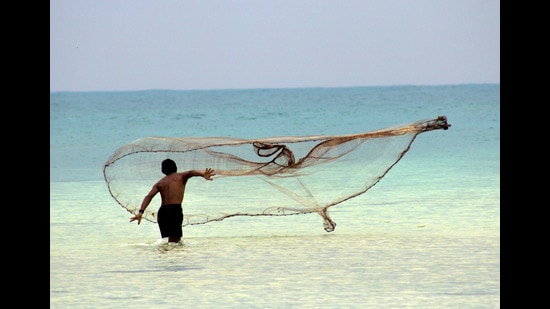 A fisherman casts his net at South Bay in Little Andaman Island. (Adhith Swaminathan)