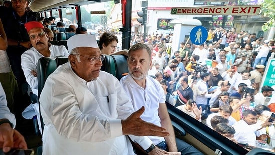 Congress president Mallikarjun Kharge and Lok Sabha LoP Rahul Gandhi sit inside a bus while travelling to Raj Ghat to protest against Chief Election Commissioner Gyanesh Kumar. (ANI)
