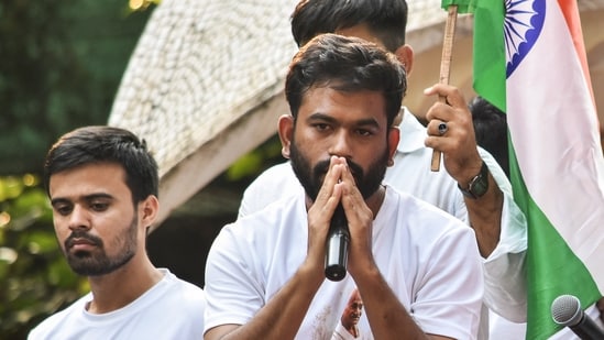 Cockroach Janta Party (CJP) founder Abhijit Dipke speaks during a protest seeking Chief Election Commissioner Gyanesh Kumar's resignation.