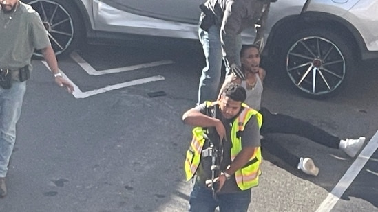 A man is detained after a shooting reportedly involving US Immigration and Customs Enforcement (ICE) officers in New York City, US, October 8, 2026.

Stephanie/Handout via REUTERS    