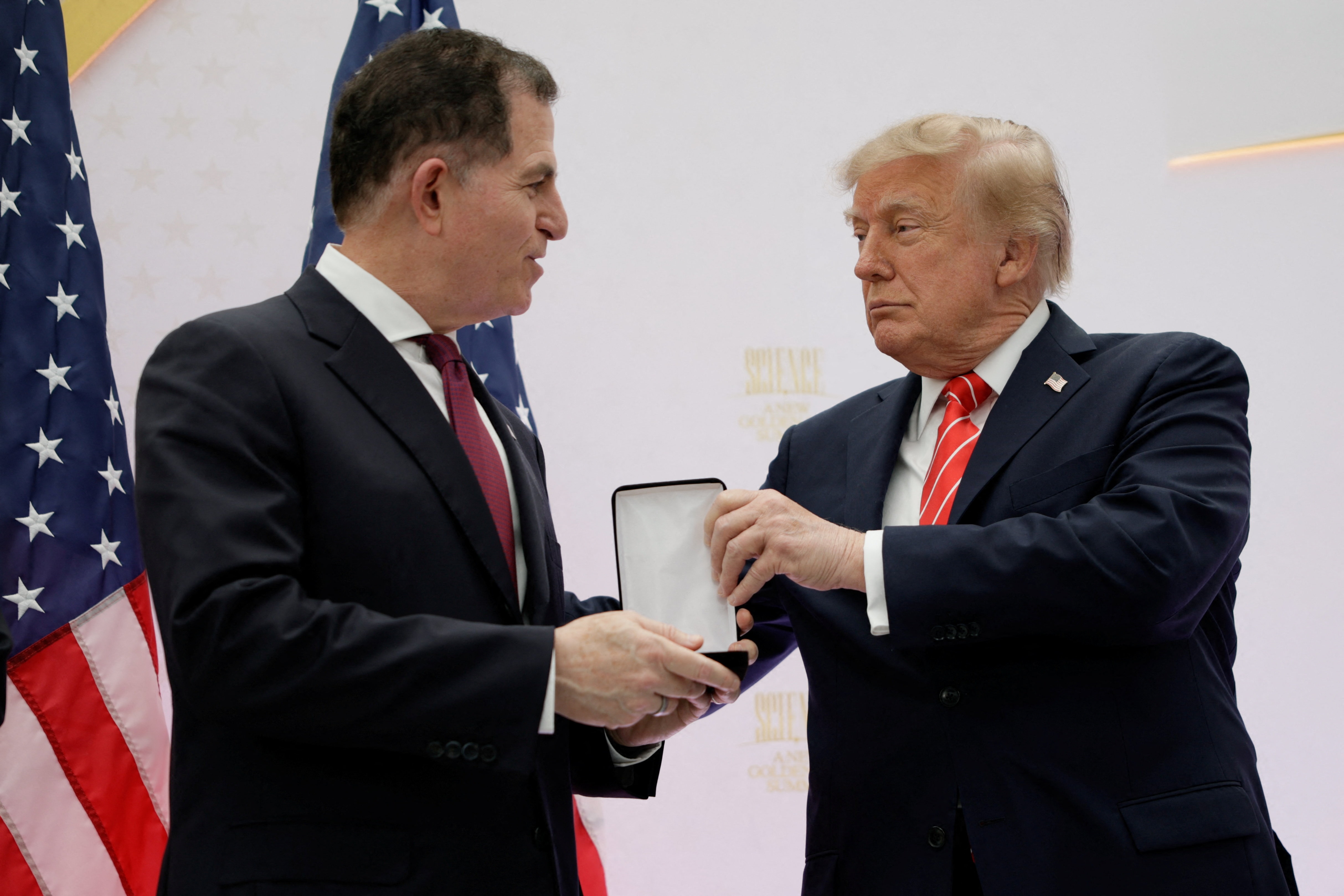 US President Donald Trump presents the National Medal of Technology and Innovation to Dell Technologies CEO Michael Dell. (REUTERS)