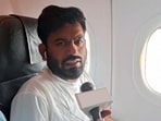 Cockroach Janta Party (CJP) Founder Abhijeet Dipke detain by the Police after the flight landed at IGI Airport, in New Delhi on Saturday. (ANI Video Grab)