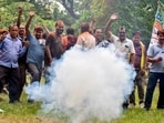 BJP supporters burst firecrackers to celebrate the party’s win in the Rejinagar bypolls in Murshidabad on Friday. (PTI)