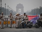 Delhi Police personnel stand guard ahead of a protest by the Cockroach Janata Party (CJP). 