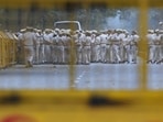 Security personnel stand guard ahead of the Cockroach Janta Party (CJP) protest seeking the resignation of India's Chief Election Commissioner Gyanesh Kumar, in New Delhi.