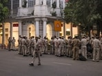 Delhi Police personnel stand guard outside Block A in the Inner Circle of Connaught Place following an anti-CEC protest organized by the CJP in New Delhi on Saturday. 