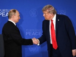 US President Donald Trump (R) and Russian President Vladimir Putin shake hands at the end of a joint press conference after participating in a US-Russia summit on Ukraine at Joint Base Elmendorf-Richardson in Anchorage, Alaska, on August 15, 2025. 