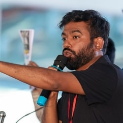 Cockroach Janta Party (CJP) founder Abhijeet Dipke during the 'people's tribunal protest, organised by various civil society groups against the Special Intensive Revision (SIR) of electoral rolls, at Freedom Park in Bengaluru.