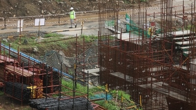 A worker walks at the site of an Amazon data centre in Thane, India. (REUTERS)