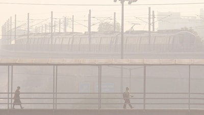 Gram it: On Friday, a Metro train was spotted plying amid low visibility caused by smog and rising air pollution in Gurugram. According to Central Pollution Control Board (CPCB), Delhi’s Air Quality Index stood at 177 in the moderate category. With winter approaching, the city’s residents are anticipating yet another smog season ahead. Several restrictions have already been announced to discourage the use of personal vehicles, starting November. (Photo: PTI)