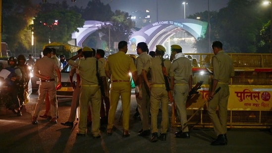 BSF personnel, along with Delhi and Noida Police, conduct security checks at the Noida–Delhi Chilla Border ahead of the ‘Cockroach Janata Party’ (CJP) protest scheduled for tomorrow at Jantar Mantar in Delhi. (Sunil Ghosh/ HT Photo)