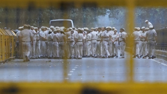 Security personnel stand guard ahead of the Cockroach Janta Party (CJP) protest seeking the resignation of India's Chief Election Commissioner Gyanesh Kumar, in New Delhi.