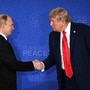 US President Donald Trump (R) and Russian President Vladimir Putin shake hands at the end of a joint press conference after participating in a US-Russia summit on Ukraine at Joint Base Elmendorf-Richardson in Anchorage, Alaska, on August 15, 2025. 
