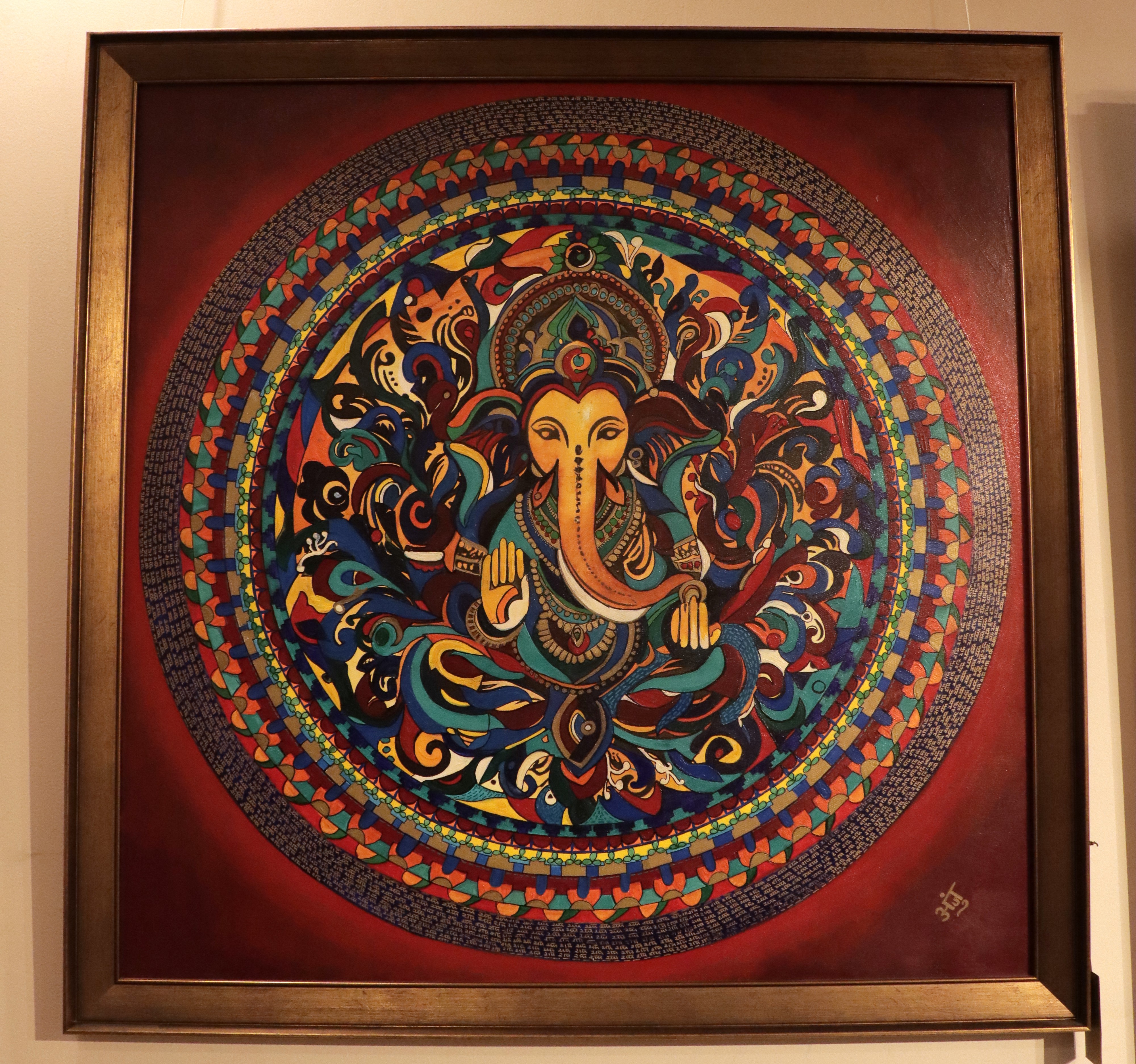 Artwork titled Divinity has Lord Ganesha at the centre of a mandala encircled with Ram naam (chant).