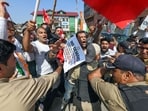 Police personnel stop INDIA bloc alliance party's workers and supporters during a protest against Chief Election Commissioner Gyanesh Kumar, in Srinagar on Saturday.
(ANI photo)