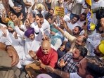 Aam Aadmi Party (AAP) leader Manish Sisodia with party leaders and workers during a protest demanding the resignation of Chief Election Commissioner (CEC) Gyanesh Kumar over alleged electoral roll irregularities, in Chandigarh. (PTI)
