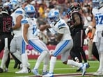 Detroit Lions running back Jahmyr Gibbs (0) celebrates his touchdown run with Amon-Ra St. Brown (14) against the Arizona Cardinals during the first half of an NFL football game in Glendale, Arizona.