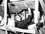 Margaret Hamilton, of Cambridge, Mass., mathematic and computer programmer at the MIT Instrumentation Laboratory, sits in mock up of Apollo command module on display at the Cambridge school, Nov. 25, 1969, where she headed group that programmed Intrepid's pinpoint landing in the Sea of Storms on the moon. (AP Photo)