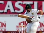 South Africa's Aiden Markram looks on as the ball evades the fielder. 