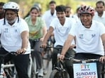 Union sports minister Mansukh Mandaviya leading a cycle rally in Varanasi on October 11. (Ht photo)