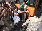 Policemen detain a protester during a youth demonstration on Saturday. (AP Photo)