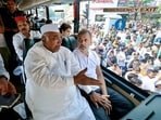 Congress president Mallikarjun Kharge and Lok Sabha LoP Rahul Gandhi sit inside a bus while travelling to Raj Ghat to protest against Chief Election Commissioner Gyanesh Kumar.