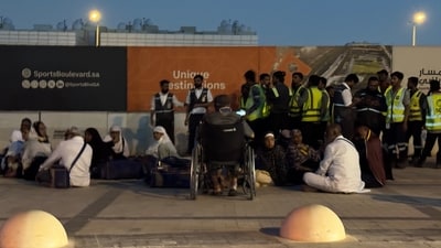 People gather outside a metro station on the road to King Khalid International Airport in Riyadh, Saudi Arabia. (AP Photo) People gather outside a metro station on the road to King Khalid International Airport in Riyadh, Saudi Arabia. (AP Photo)