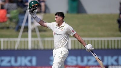 Australia's Matt Renshaw raises his helmet to celebrate his 150 runs on day two. (AFP)