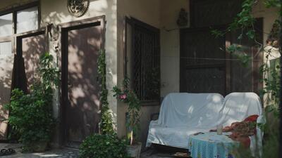 In the morning, the gates in the neighbourhood are left open for newspaper vendors, and a garden chair is set beside its side table. (Courtesy: Ishwar Prasad) In the morning, the gates in the neighbourhood are left open for newspaper vendors, and a garden chair is set beside its side table. (Courtesy: Ishwar Prasad)