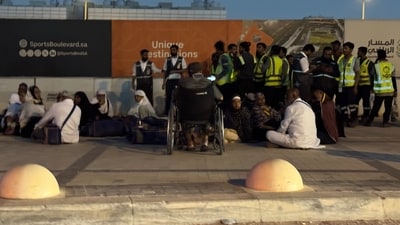 People gather outside a metro station on the road to King Khalid International Airport in Riyadh, Saudi Arabia. (AP Photo) People gather outside a metro station on the road to King Khalid International Airport in Riyadh, Saudi Arabia. (AP Photo)