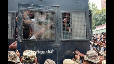 Police personnel detain protestors amid continued demonstration in Connaught Place area on Sunday. (PTI) Police personnel detain protestors amid continued demonstration in Connaught Place area on Sunday. (PTI)