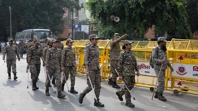 Security personnel arrive for their deployment at a temporary checkpoint near Jantar Mantar. (AFP)