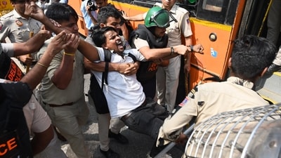 Policemen detain a protester during a youth demonstration on Saturday. (AP Photo) Policemen detain a protester during a youth demonstration on Saturday. (AP Photo)