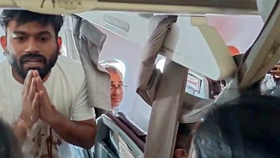 Cockroach Janta Party (CJP) Founder Abhijeet Dipke detain by the Police after the flight landed at IGI Airport, in New Delhi on Saturday. (ANI Video Grab)