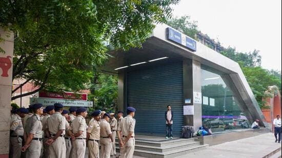 Security personnel stand guard near Janpath Metro Station. (PTI)