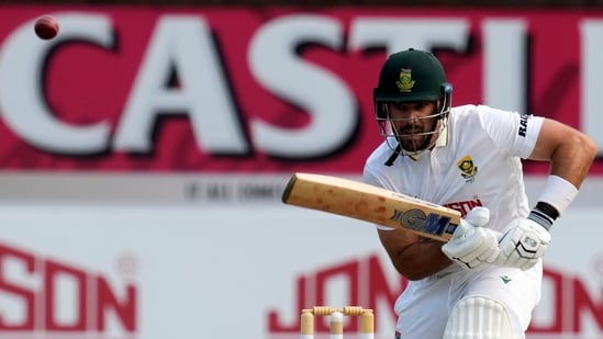 South Africa's Aiden Markram looks on as the ball evades the fielder. 
