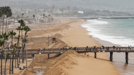 Newport Beach declared an emergency after coastal flooding submerged streets, stranded vehicles and prompted warnings of more flooding.. (Stephen Lam/San Francisco Chronicle via AP) (Stephen Lam/San Francisco Chroni)