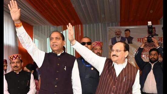 Union minister for health and family welfare and chemicals and fertilizers JP Nadda (right) with former Himachal CM Jai Ram Thakur at an event in Kullu on Sunday. (Aqil Khan/HT)
