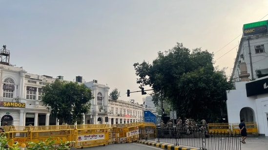 Barricades remain in place at Connaught Place on Sunday morning as Delhi Police continue security measures amid the CJP protests. Barricades remain in place at Connaught Place on Sunday morning as Delhi Police continue security measures amid the CJP protests.