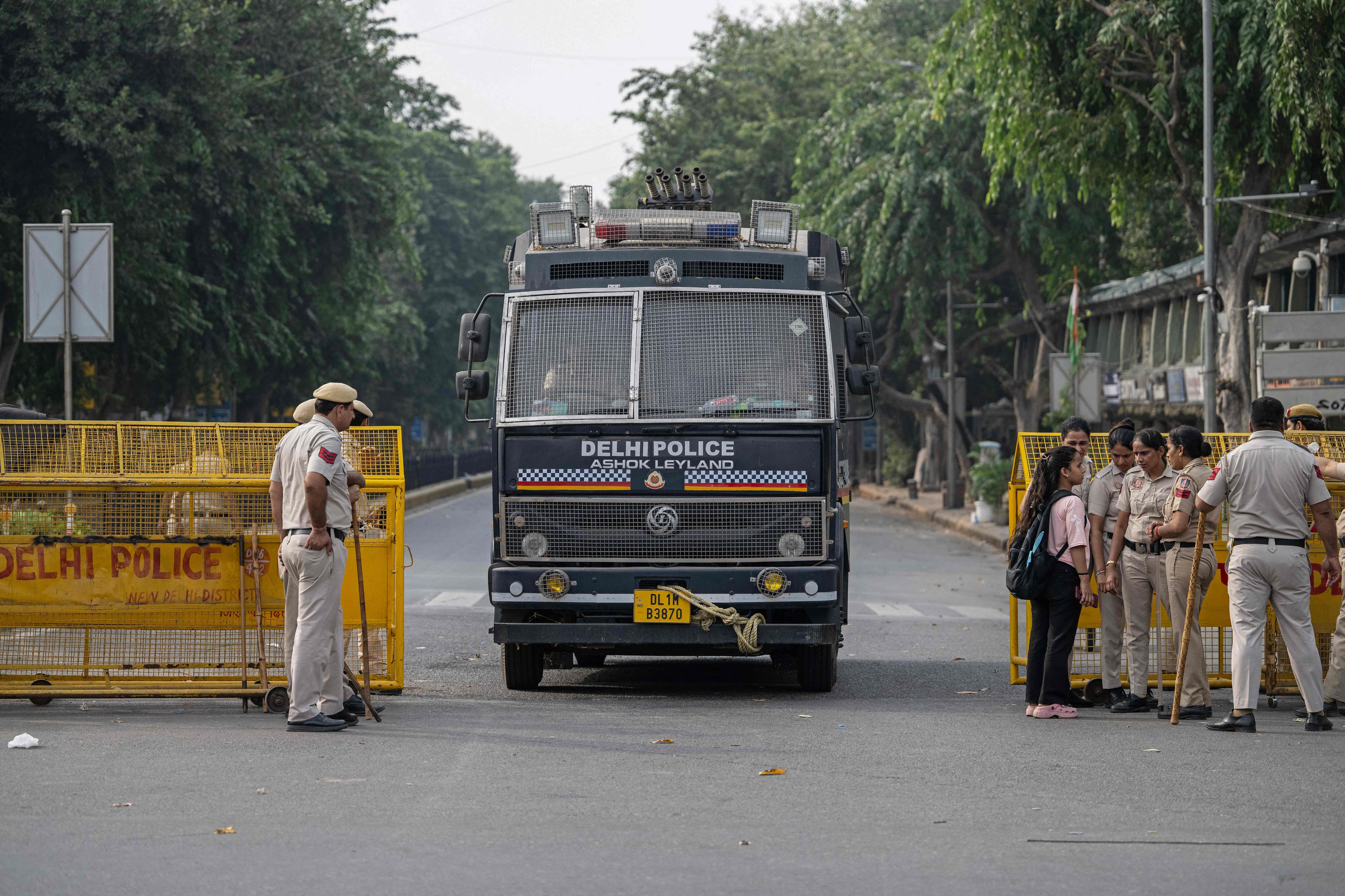 A multi-barrel teargas shell launching vehicle drives past a temporary checkpoint amid ongoing protests demanding the resignation of India's Chief Election Commissioner Gyanesh Kumar over alleged voter roll irregularities linked to the "special intensive revision" (SIR), near Jantar Mantar in New Delhi on October 11, 2026. A New Delhi court ordered on October 11 the release of three leaders of the "cockroach" movement, including its founder Abhijeet Dipke, their lawyer said, a day after they were detained. (Photo by Sajjad HUSSAIN / AFP) (AFP) A multi-barrel teargas shell launching vehicle drives past a temporary checkpoint amid ongoing protests demanding the resignation of India's Chief Election Commissioner Gyanesh Kumar over alleged voter roll irregularities linked to the "special intensive revision" (SIR), near Jantar Mantar in New Delhi on October 11, 2026. A New Delhi court ordered on October 11 the release of three leaders of the "cockroach" movement, including its founder Abhijeet Dipke, their lawyer said, a day after they were detained. (Photo by Sajjad HUSSAIN / AFP) (AFP)